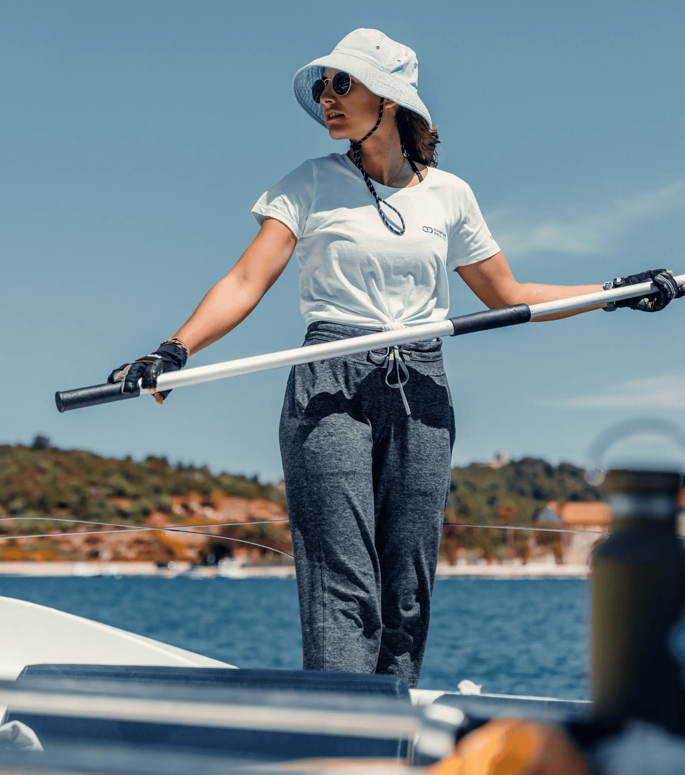 Skipper Academy trainee handling sailing equipment on a yacht