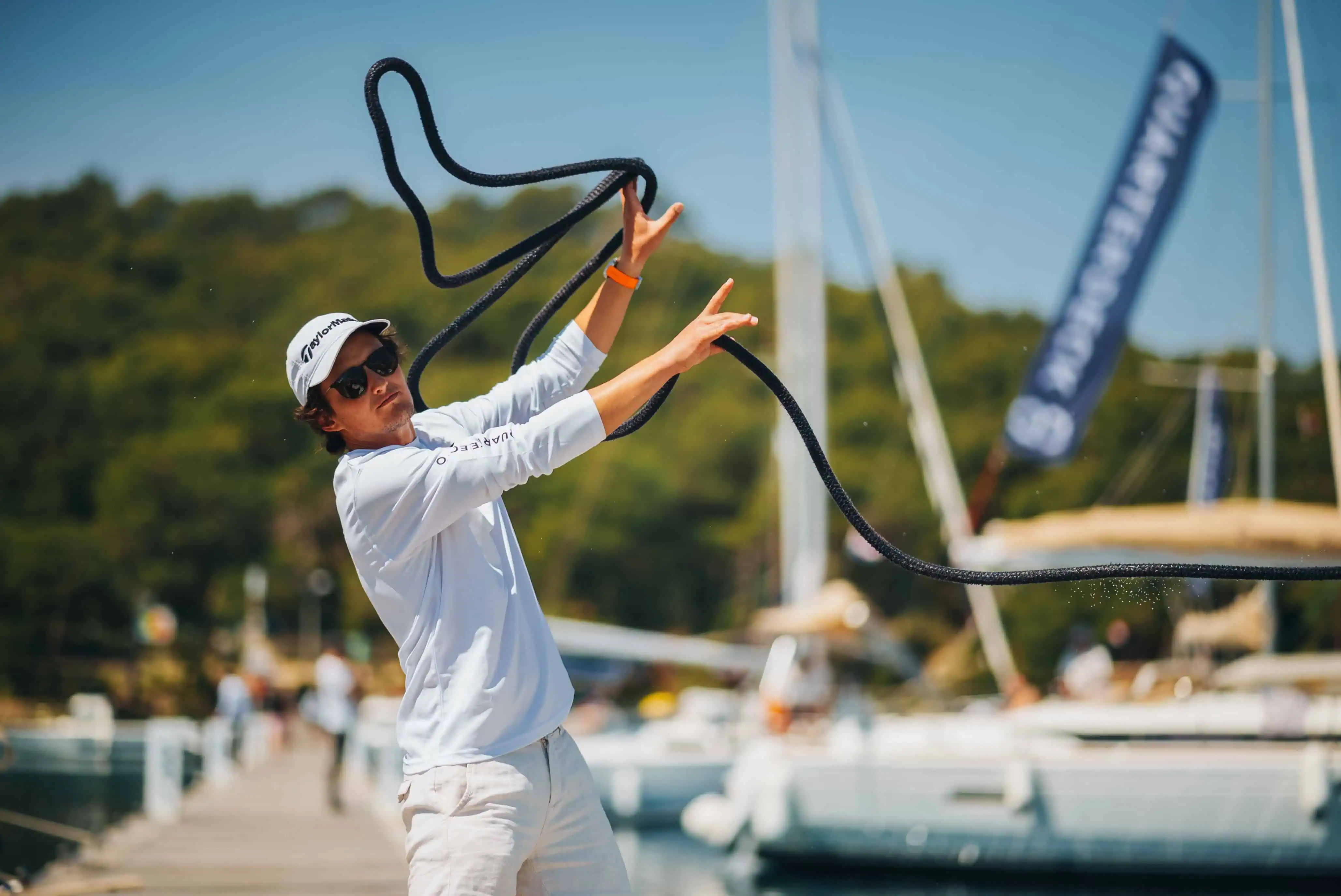 Sailing academy student practicing sailing skills on a yacht