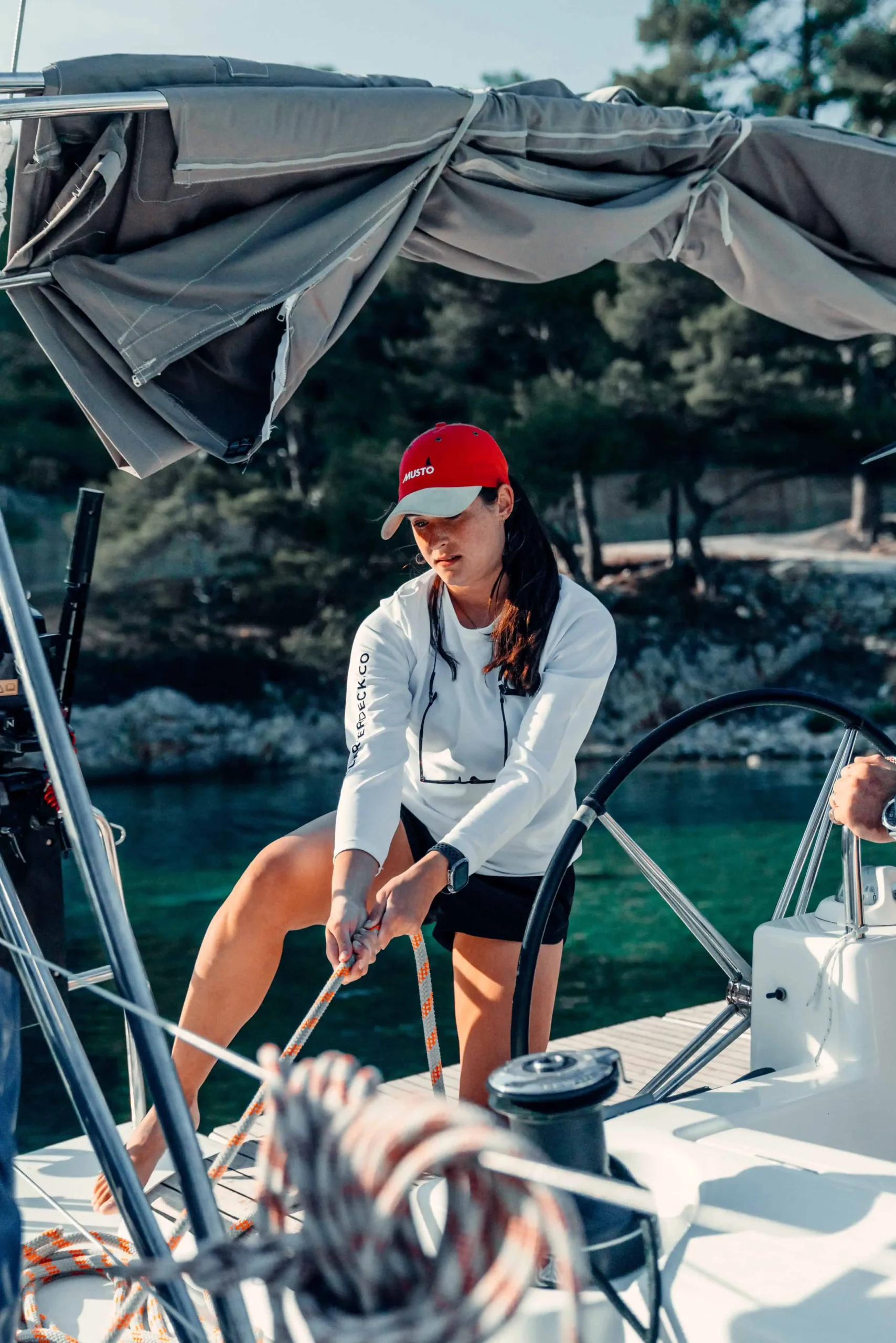 Skipper Academy trainee practicing yacht handling during sailing training