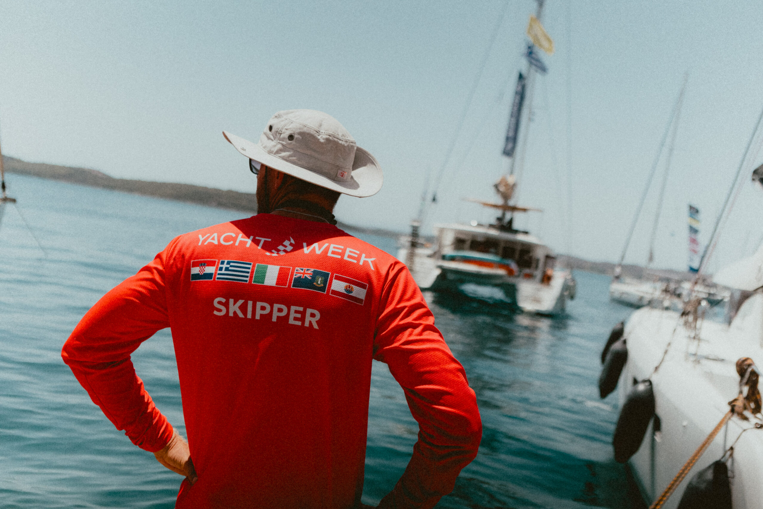 Professional skipper overseeing yacht operations in an international charter setting