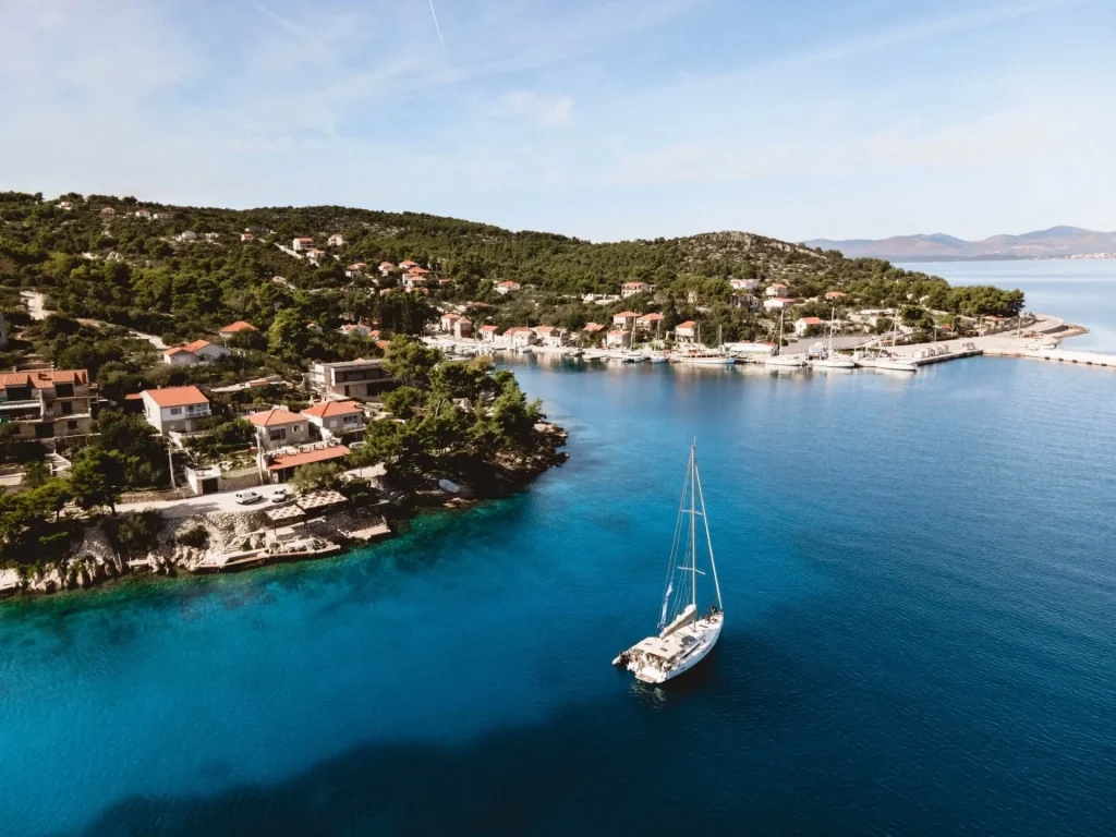 Charter yachts moored in a coastal marina viewed from above
