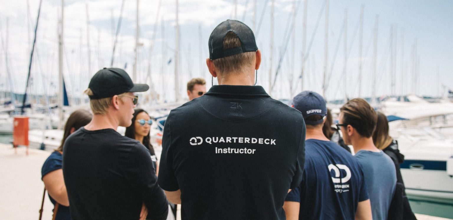 Quarterdeck instructor briefing Skipper Academy students.