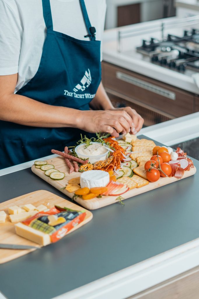 Yacht host preparing refreshments for guests