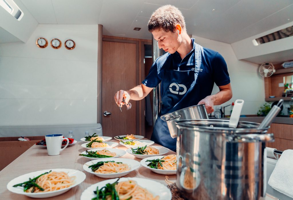 Yacht Chef preparing food in a yacht galley